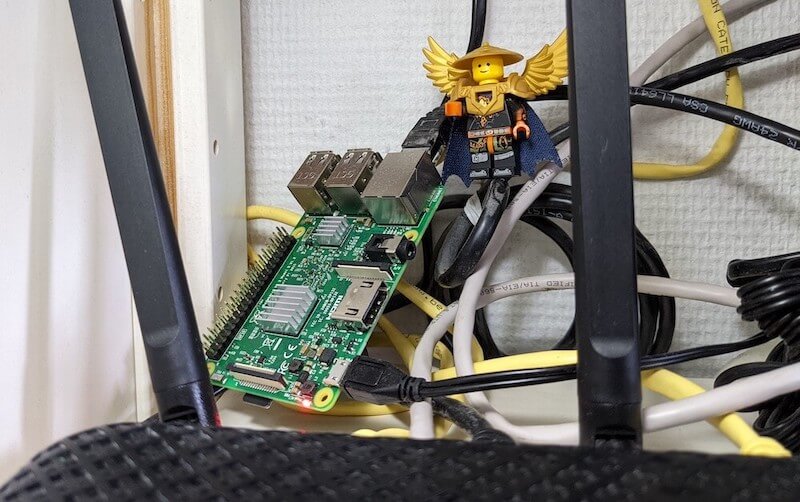 The Raspberry Pi board behind a router